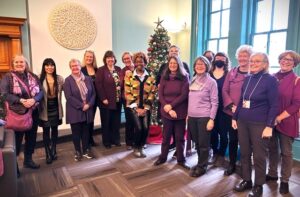 MPs Leah Gazan and Anita Vandenbeld with Ottawa-Gatineau GRANs wearing purple at launch for 16 Days of Activism. Also present, Yamikani Msosa, Executive Director of the Ottawa Coalition to End Violence Against Women (OCTEVAW)