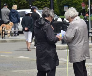 GRAN Member Anne Young (L) handing out information on DSM