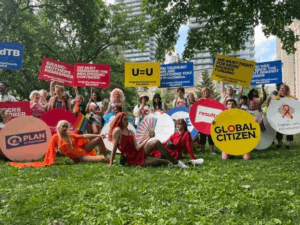 Group of GRANs holding up signs at the Toronto Pride Parade