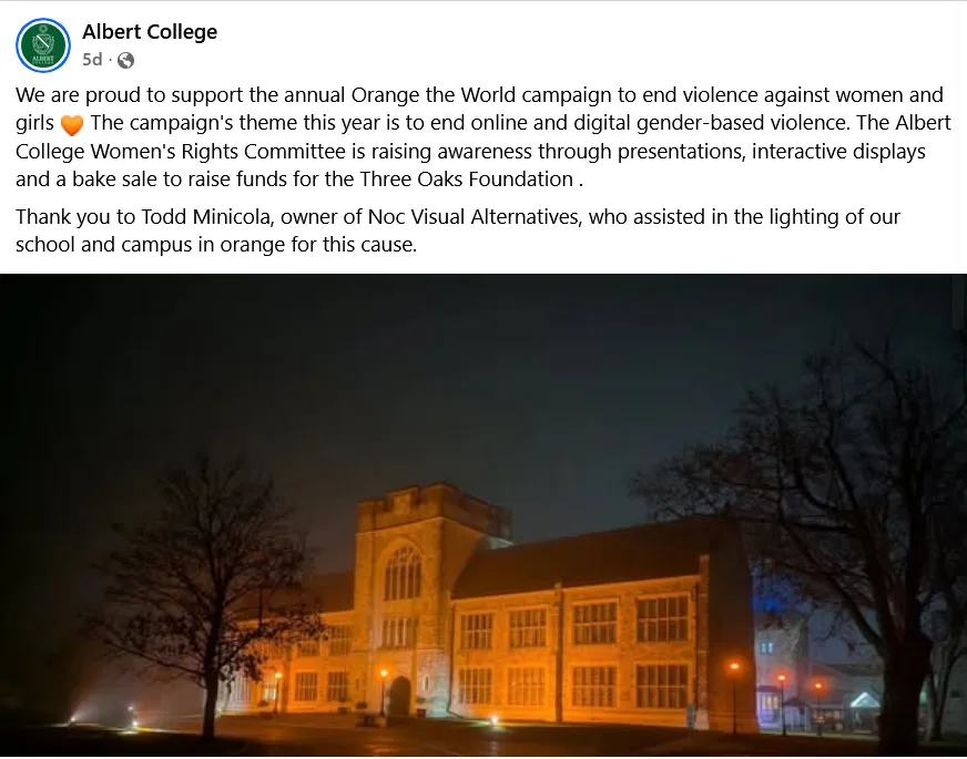 Albert College lit up in orange at night