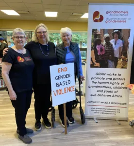 Three GRAN members with GRAN banner